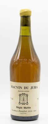 bottles of wine are lined up on a white surface