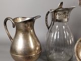 a lot of silver items that are on the table
