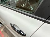 a close up of a car door handle on the side of the car