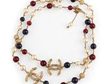 a close up of a necklace on a white background