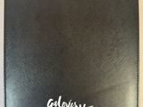 a close up of a black wallet with a white logo on it