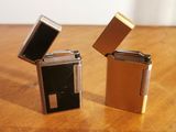two lighters that are sitting on a table
