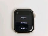 an apple watch sitting on top of a white table