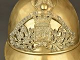 a gold helmet with a crest and a crown on it