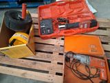 a box of tools sitting on a pallet in a warehouse