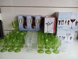 a lot of green glassware on the counter