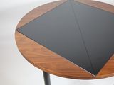 a small table with a black top on a white background