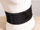 a close up of a mannequin head with a black belt