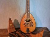 a guitar and other musical instruments sitting on a table