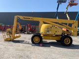a yellow crane that is parked in a parking lot