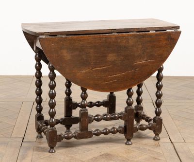 a close up of a table with a wooden top on a wooden floor