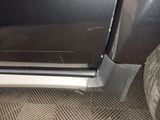 a close up of a car door with the door handle missing