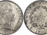 a silver coin with a woman ' s face on it