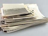 a stack of old photos sitting on top of each other