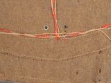 a close up of a piece of fabric with a hole in it