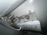 a fan that is hanging from the ceiling in a room