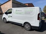 a white van that is parked in a parking lot