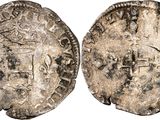 a silver coin with an image of a man on it