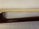 a wooden handle that is attached to a piece of wood