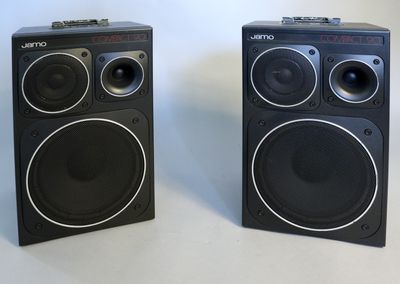 two speakers sitting next to each other on a table
