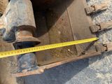 a close up of a piece of machinery with a measuring tape on it