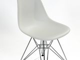 an image of a white chair with a wire base