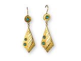 a pair of gold earrings with turquoise stones