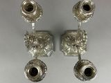 pair of antique silver candlesticks with floral design