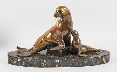 bronze sculpture of a sealion and a baby seal on a marble base