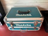 a blue and silver case sitting on top of a red table