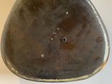 an image of a piece of metal with holes in it