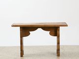 a small table with a wooden top on the floor