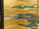 an image of a room divider with a painting of a beach and mountains