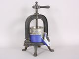a small blue pot sitting on top of a metal stand