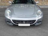 a silver sports car parked in a parking lot