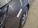 a close up of a car ' s headlight with a sticker on it