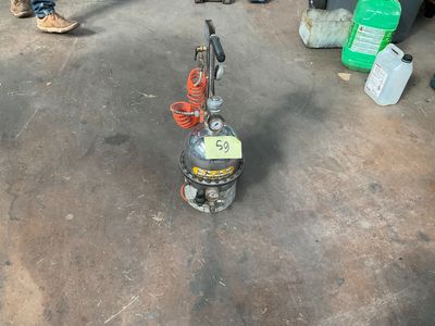 a machine that is sitting on the ground with a sign on it