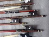 a lot of different types of bows and knives on the table