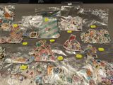 a lot of stamps on the table with stickers on them