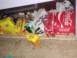 a lot of chips and sodas on the floor