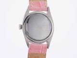 wrist watch with pink leather strap on white background against white background
