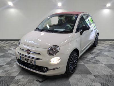 la photo d'une petite voiture blanche garée dans un garage