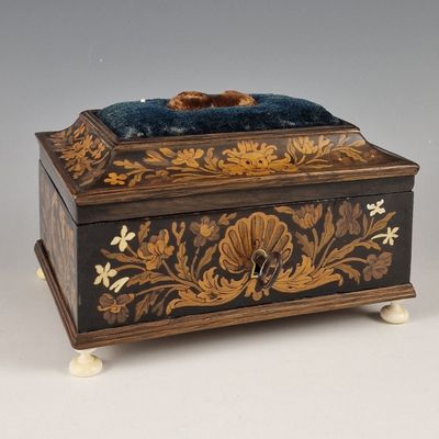 a wooden box that has a blue velvet on it