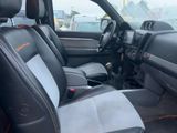the interior of a car with black leather seats and a gray dashboard