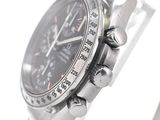 a close up of a watch on a metal bracelet