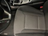 the interior of a car with a steering wheel and dashboard controls