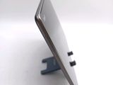 a close up of a cell phone on a stand