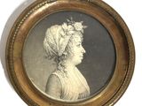 an old picture of a woman with a hat on her head in a gold frame