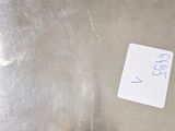 a piece of paper that has been placed on a metal surface
