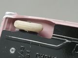 a banana sitting on top of a black and pink box